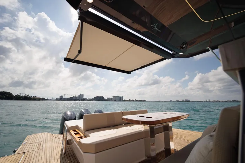 Slide: The Image of Luxurious Hanover 447 yacht deck with seating, awning, and ocean view, 2026 model. - 33