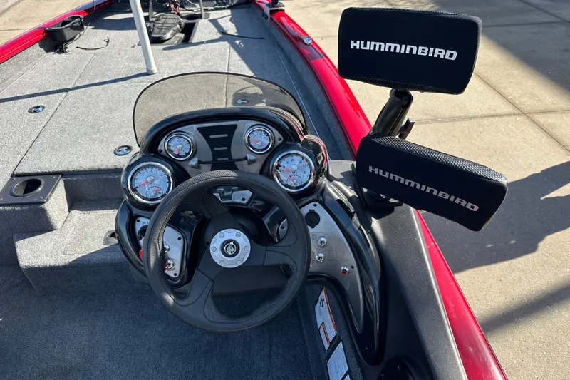 Slide: The Image of 2024 Tracker Pro Team 175 TXW boat dashboard with Humminbird electronics and steering wheel. - 6