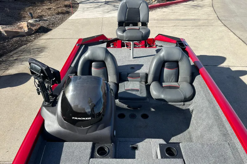 Slide: The Image of 2024 Tracker Pro Team 175 TXW boat interior with seating and console. - 7