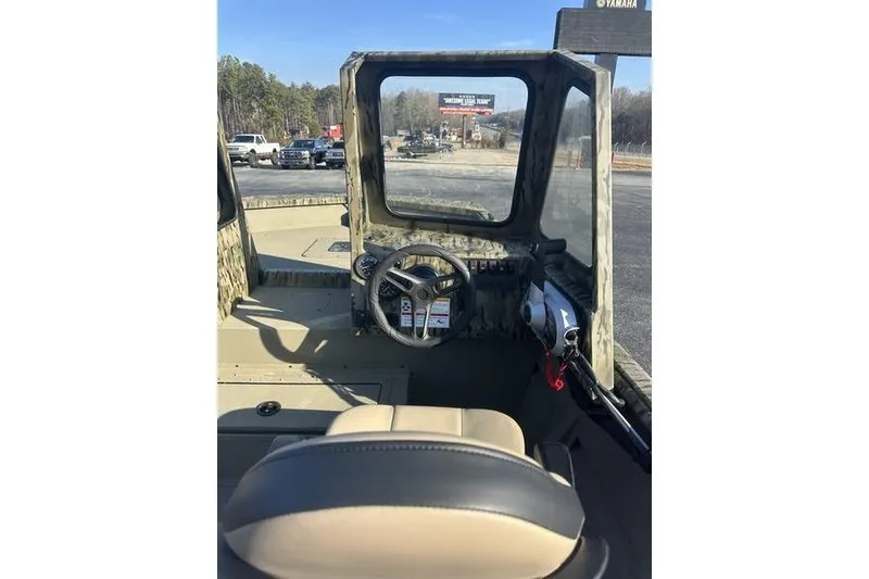 Slide: The Image of Interior view of 2026 SeaArk 2272 MV boat with steering wheel and controls. - 8