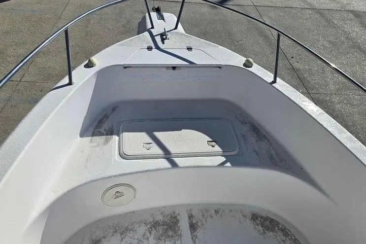 Slide: The Image of 2001 Pro-Line 19 Sport boat bow with storage compartment and railing. - 11