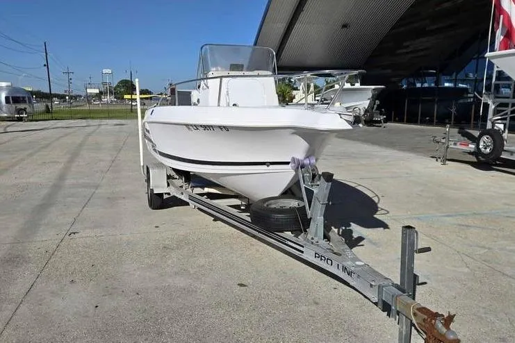 Slide: The Image of 2001 Pro-Line 19 Sport boat on trailer in outdoor storage area. - 12