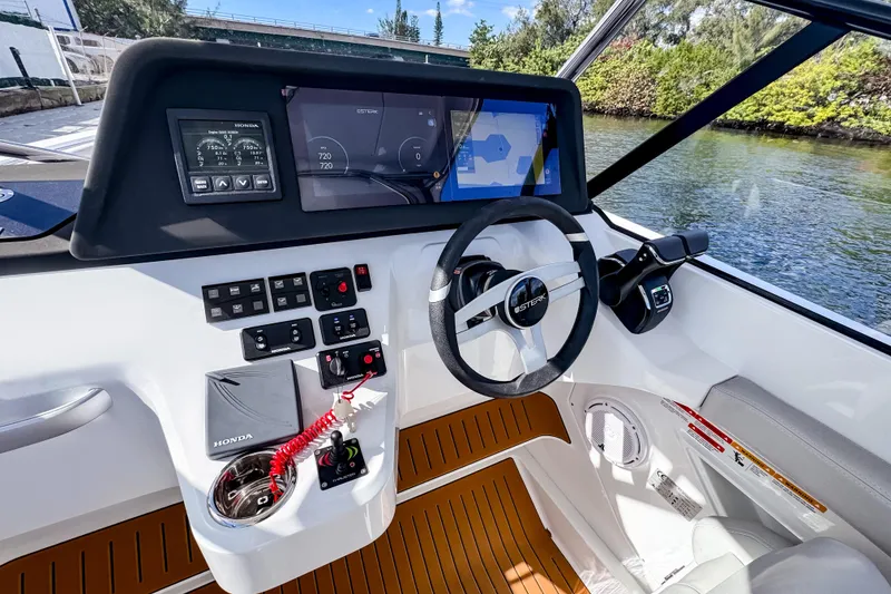 Slide: The Image of Cockpit of 2025 STERK 31 boat with modern controls and navigation displays. - 11
