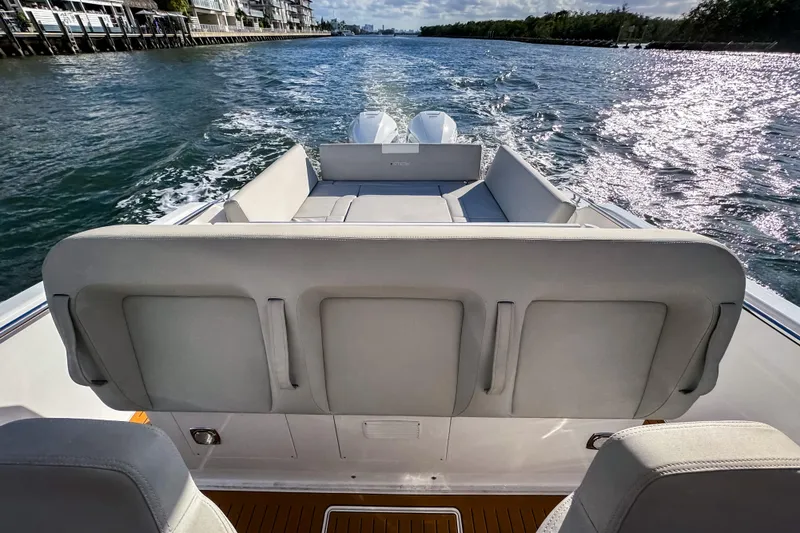 Slide: The Image of Luxury STERK 31 boat cruising on a sunny waterway, 2025 model. - 9