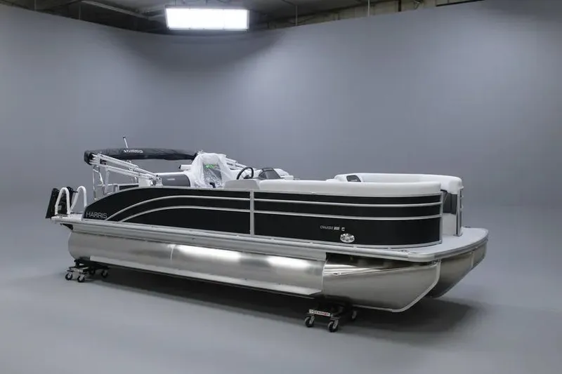 The Image of 2026 Harris FloteBote 230 Cruiser pontoon boat in a showroom setting. - 1