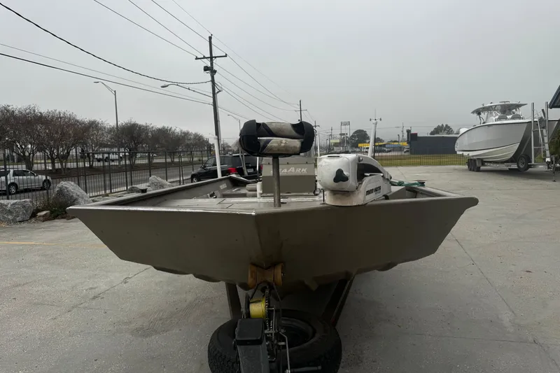 Slide: The Image of 2007 SeaArk Coastal 200 CC boat on trailer in parking lot, overcast day. - 10
