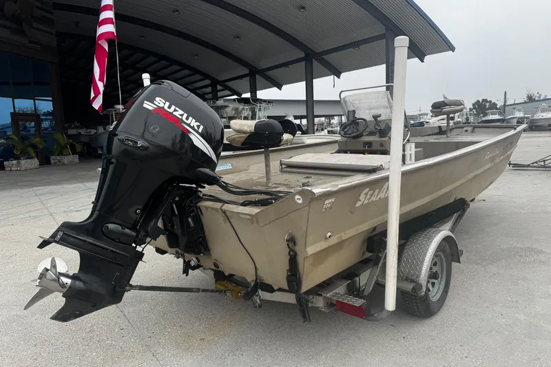 Slide: The Image of 2007 SeaArk Coastal 200 CC boat with Suzuki outboard motor on trailer. - 5