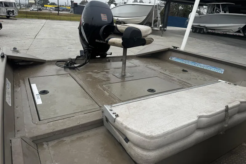 Slide: The Image of 2007 SeaArk Coastal 200 CC boat with Suzuki outboard motor, docked on concrete. - 6