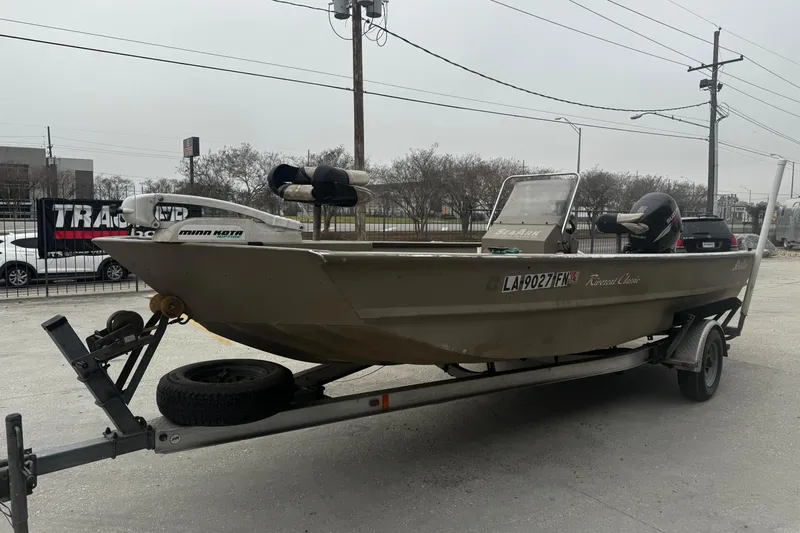 Slide: The Image of 2007 SeaArk Coastal 200 CC boat on trailer, parked outdoors. - 9
