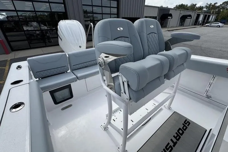 Slide: The Image of 2026 Sportsman Heritage 231 Center Console boat with modern seating and sleek design. - 13