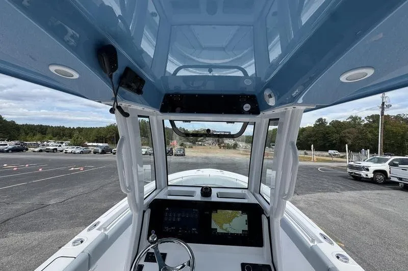 Slide: The Image of 2026 Sportsman Heritage 231 Center Console interior view with navigation system. - 19