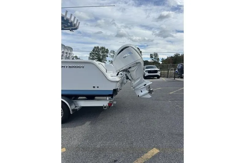 Slide: The Image of 2026 Sportsman Heritage 231 Center Console boat with Yamaha outboard motor in parking lot. - 4