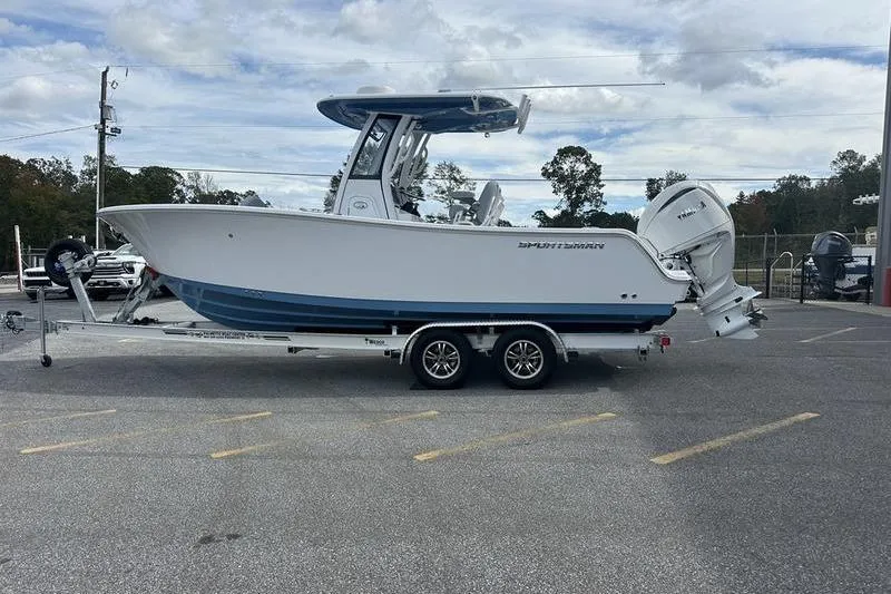 Slide: The Image of 2026 Sportsman Heritage 231 Center Console boat on trailer in parking lot. - 5