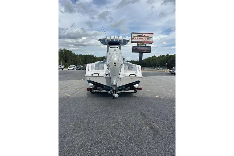 Slide: The Image of 2026 Sportsman Heritage 231 Center Console boat on trailer in parking lot. - 6