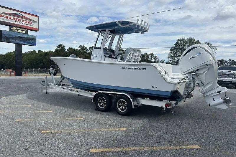 Slide: The Image of 2026 Sportsman Heritage 231 Center Console boat on trailer at dealership. - 7