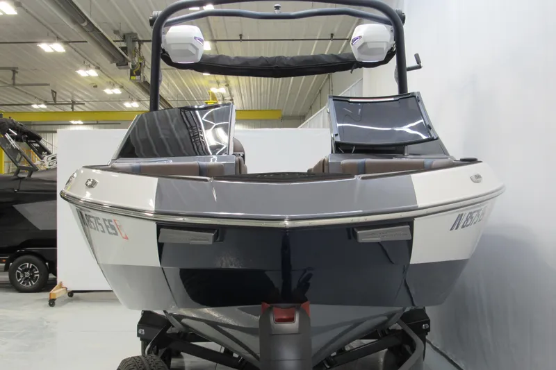 Slide: The Image of 2025 Malibu Wakesetter 23 LSV boat in showroom, front view. - 14
