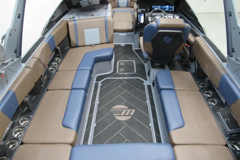 Slide: The Image of 2025 Malibu Wakesetter 23 LSV interior with luxurious seating and modern dashboard. - 15