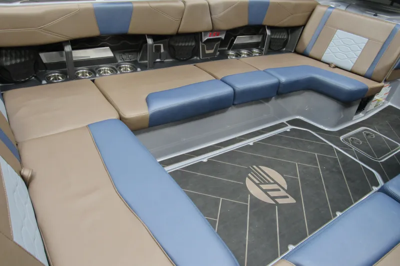 Slide: The Image of Luxurious interior of 2025 Malibu Wakesetter 23 LSV with blue and brown seating. - 17