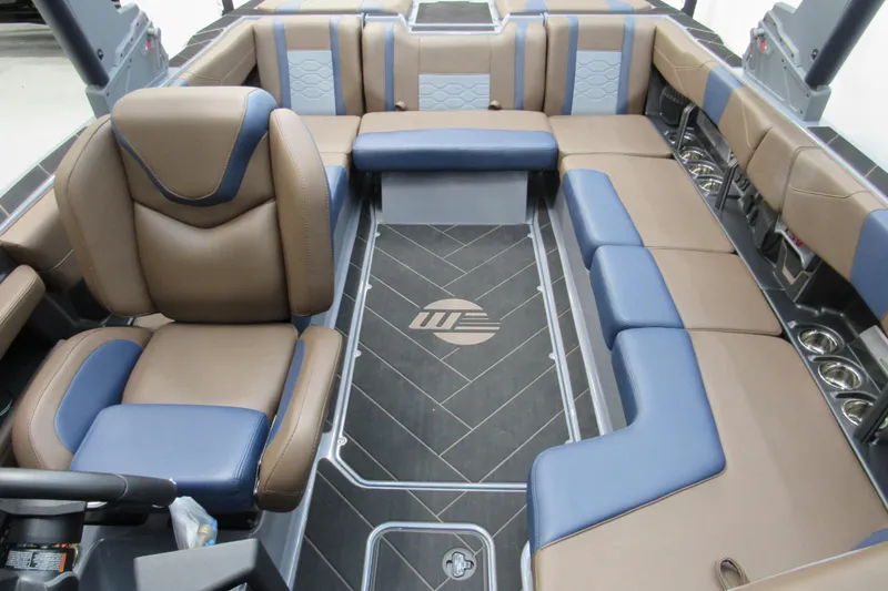 Slide: The Image of 2025 Malibu Wakesetter 23 LSV interior with luxurious brown and blue seating. - 5