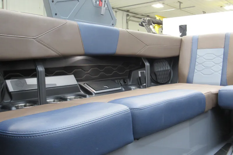 Slide: The Image of 2025 Malibu Wakesetter 23 LSV interior seating with modern design and cup holders. - 9