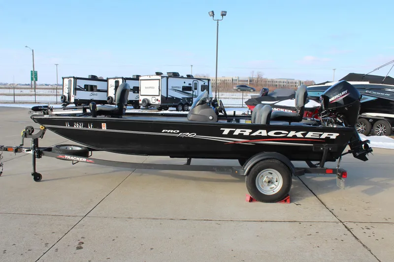 The Image of 2024 Tracker Pro 170 boat on trailer in outdoor dealership lot. - 0