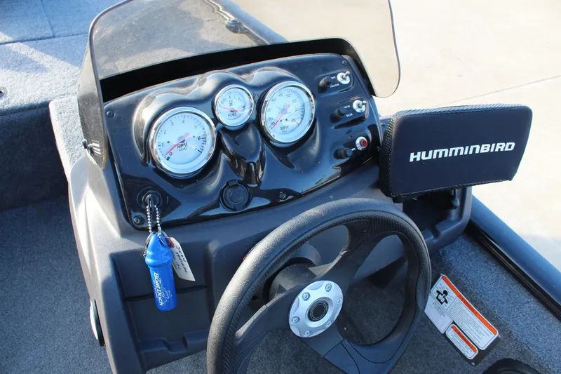 Slide: The Image of 2024 Tracker Pro 170 dashboard with gauges and Humminbird fish finder. - 10