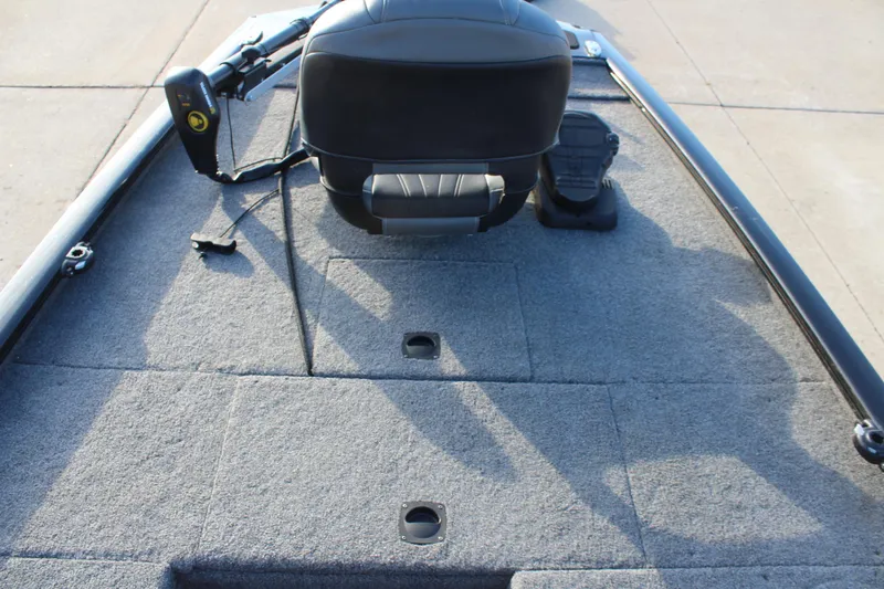 Slide: The Image of 2024 Tracker Pro 170 boat interior with seating and carpeted deck. - 11