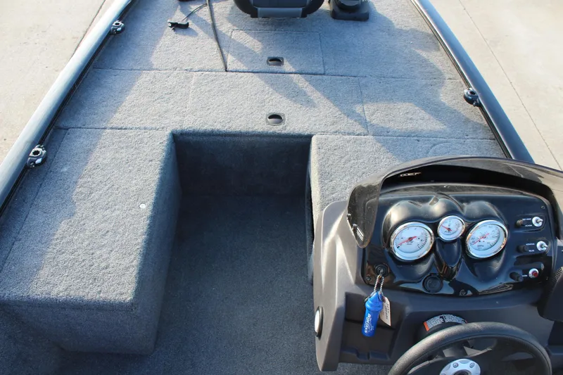 Slide: The Image of 2024 Tracker Pro 170 boat interior with dashboard and seating area. - 17