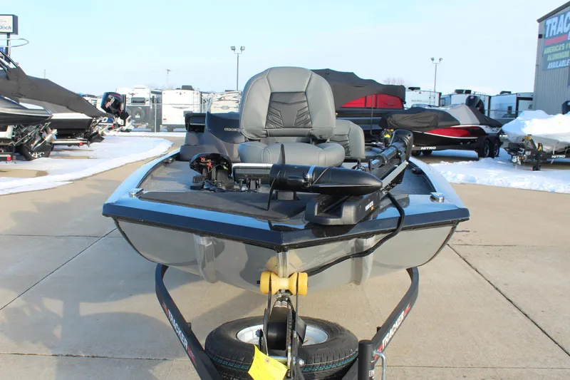 Slide: The Image of 2024 Tracker Pro 170 boat on trailer, displayed outdoors in a snowy setting. - 2