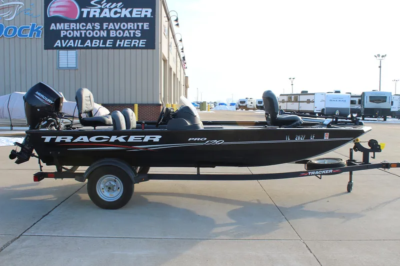 Slide: The Image of 2024 Tracker Pro 170 boat on trailer, displayed outside dealership. - 4