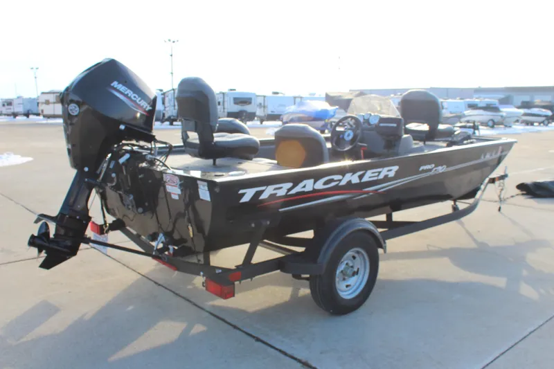 Slide: The Image of 2024 Tracker Pro 170 boat with Mercury engine on trailer in outdoor setting. - 5