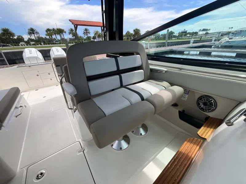 Slide: The Image of Interior view of a Boston Whaler 330 Vantage with comfortable seating and modern design. - 20