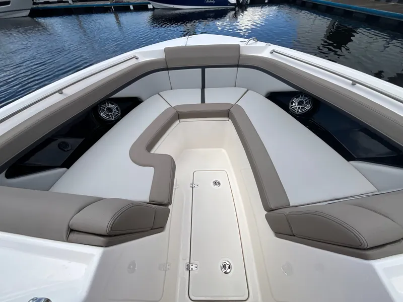 Slide: The Image of Bow area of the Boston Whaler 330 Vantage with cushioned seating and speakers. - 27