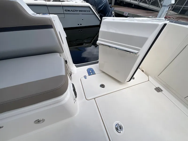 Slide: The Image of The image shows the deck of a Boston Whaler 330 Vantage with an open door to the water. - 15