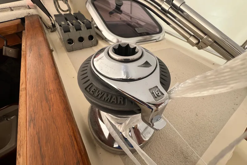 Slide: The Image of Lewmar winch on 1996 Caliber 35 LRC sailboat deck, featuring wooden trim. - 12