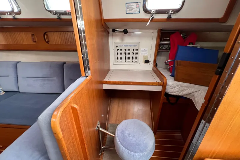 Slide: The Image of 1996 Caliber 35 LRC yacht interior with navigation station and seating area. - 25