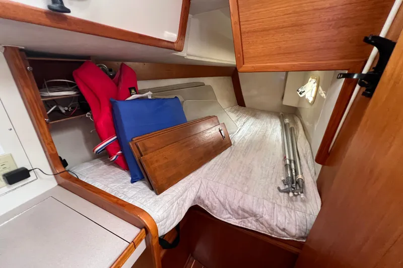 Slide: The Image of Cozy cabin interior of 1996 Caliber 35 LRC sailboat with storage and equipment. - 28