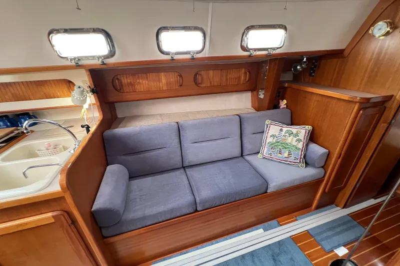 Slide: The Image of Interior of 1996 Caliber 35 LRC yacht with cozy seating and nautical decor. - 30