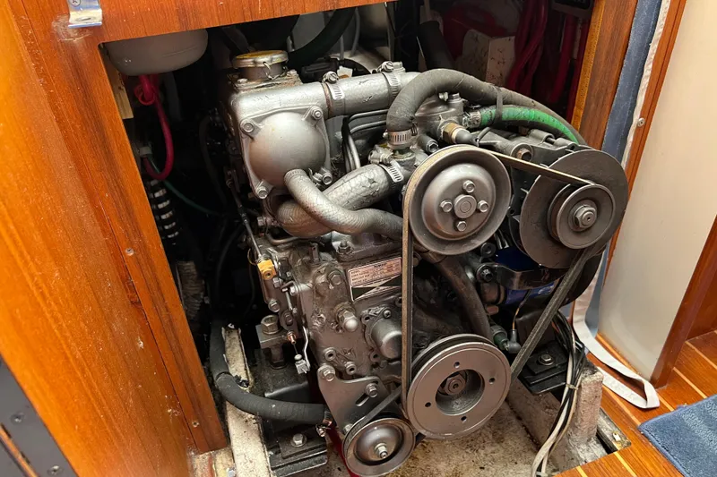 Slide: The Image of Engine compartment of a 1996 Caliber 35 LRC sailboat, showcasing mechanical components. - 39