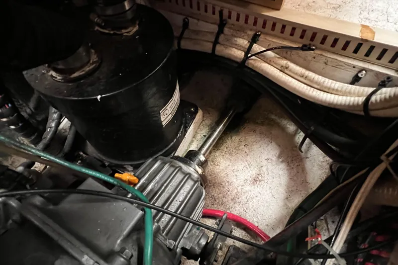 Slide: The Image of Engine compartment of a 1996 Caliber 35 LRC sailboat, showing mechanical components and wiring. - 42