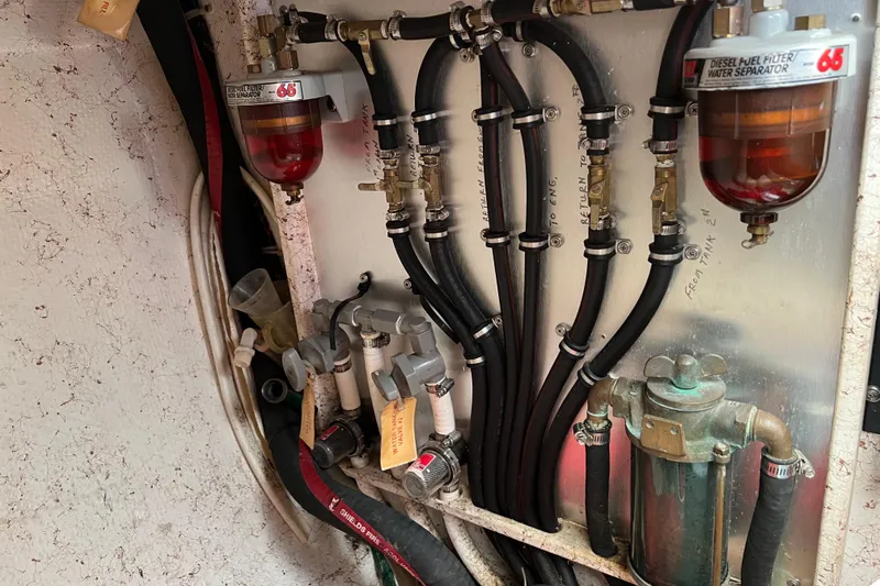 Slide: The Image of Engine compartment of 1996 Caliber 35 LRC with fuel filters and hoses. - 45