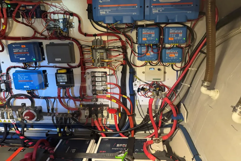 Slide: The Image of Electrical system setup in a 2023 NEEL 43 model, featuring wiring and control panels. - 14