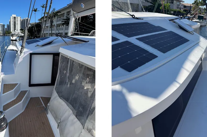 Slide: The Image of 2023 NEEL 43 trimaran with solar panels, docked in a marina under clear skies. - 3