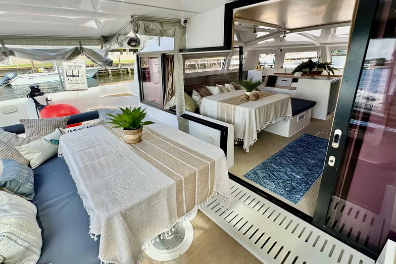 Slide: The Image of Luxurious interior of 2023 NEEL 43 yacht with elegant dining area and cozy seating. - 4