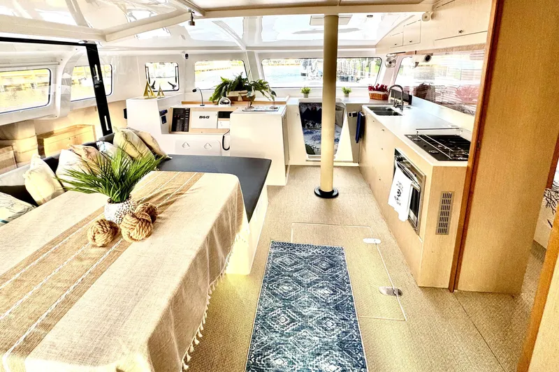 Slide: The Image of Modern NEEL 43 interior with dining area, kitchen, and nautical decor, 2023 model. - 6