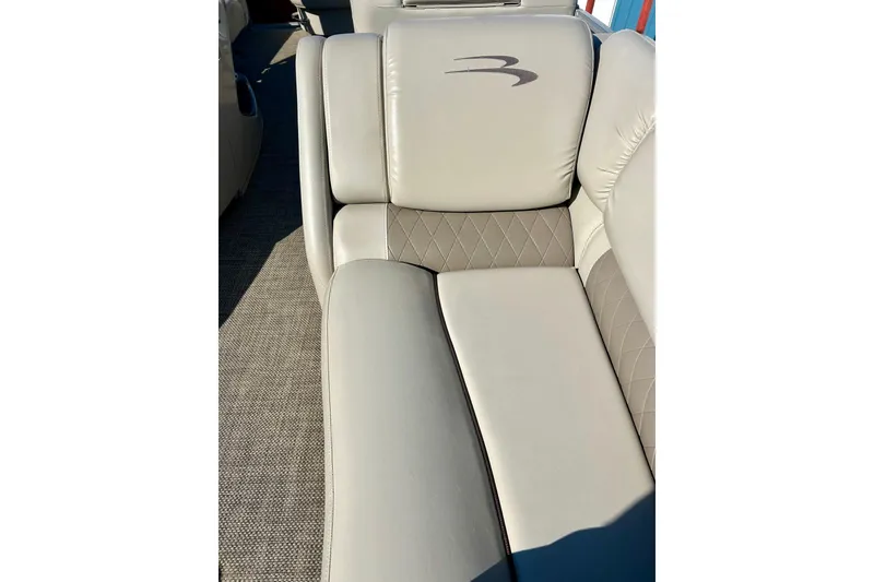 Slide: The Image of 2016 Bennington R21 boat interior with beige leather seating and quilted design. - 10