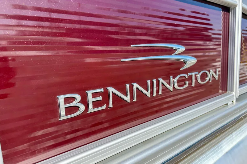 Slide: The Image of 2016 Bennington R21 logo on a red background with metallic accents. - 27