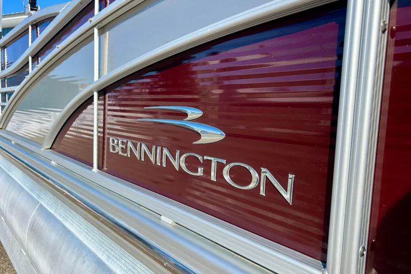 Slide: The Image of 2016 Bennington R21 pontoon boat with maroon and silver detailing. - 3