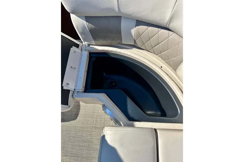 Slide: The Image of 2016 Bennington R21 boat seat storage compartment, open with quilted upholstery. - 33