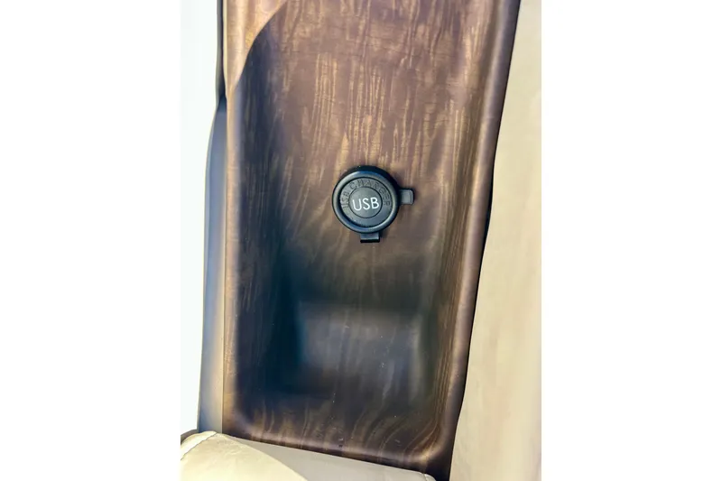 Slide: The Image of USB port on 2016 Bennington R21 boat with wood finish panel. - 38